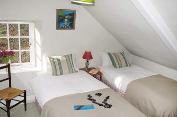 Bedroom 3 has 'zip and link' (double or twins) beds and limited head room on one side.