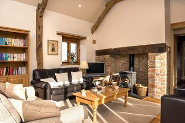 The sitting-room is charming with oak flooring and large comfy sofas.