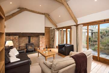 The wall of windows makes the room so bright and sunny, it's a great room for relaxing in.