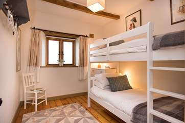 The bunk-room is delightful (please note the window has opaque glass as it overlooks a part of the neighbour's garden - which is rarely used).
