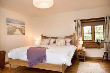 The double aspect master bedroom is very spacious and beautifully furnished.