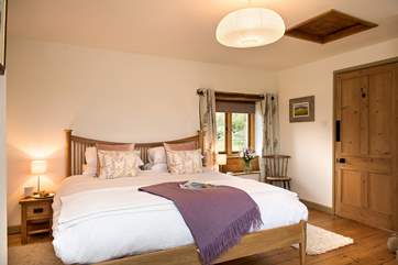 The master bedroom enjoys views over the open countryside out to sea.