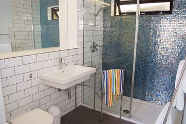 The gorgeous shower-room includes a spacious shower cubicle.