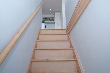 The stairs down to the double bedroom on the lower ground floor are typically steep cottage stairs, and there are two additional steps at the bottom of the stairs as you turn into the bedroom.