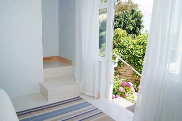 The double bedroom has a door opening out onto steps, but please watch for the uneven paving below as this outside space is not generally for use by guests.