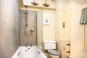Soft muted tones in the cottage bathroom.