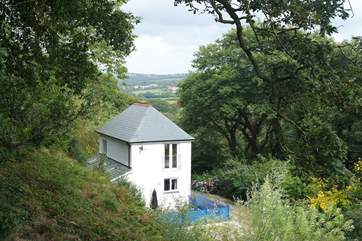 Christmas Cottage is tucked away amid 20 acres of sheltered grounds, overlooking beautiful Bicton Woods and Dartmoor in the far distance.