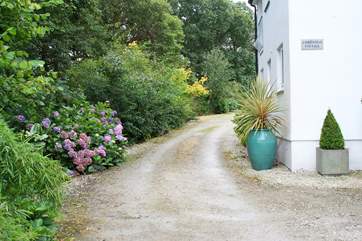 The private driveway passes Christmas Cottage to the parking-area beyond.