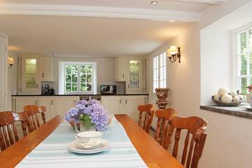 A big table to gather around, just a step up from the kitchen-area.