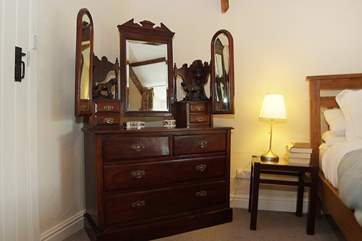 A beautiful antique chest of drawers in Bedroom 1.