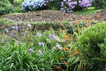 Lovely stone walls enclose the little front garden.