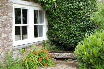A sheltered stone bench outside the drawing-room.