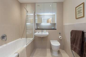 The family bathroom - another lovely room with an extra wide door, bath and fitted shower.