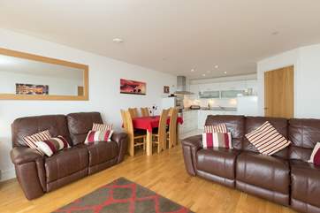 Another view of the open plan living space. The door behind the sofa is to the utility-room.