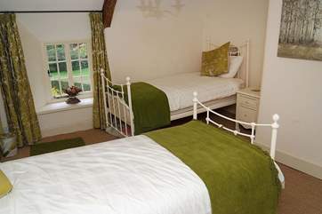 The twin bedroom (Bedroom 2) in the cottage looks over the garden.