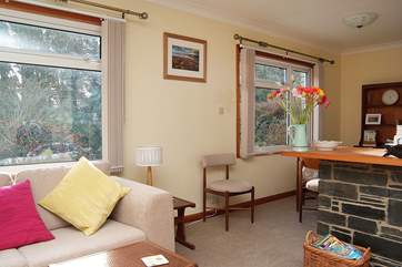 The sitting-room leads to the dining-area.