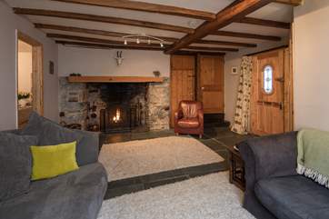 The glowing woodburner perfects the atmosphere.