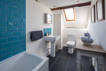 The family bathroom is light and airy. Perfect for washing the days adventures away.