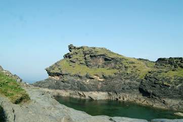 Boscastle's dog-leg harbour leads out to the open sea.