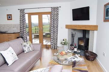 The lovely sitting-room which has a wood-burner for those cooler evenings.