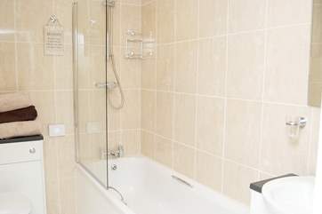 The bright white family bathroom.