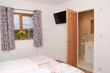 The twin bedroom has an en suite shower-room.