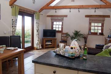The large open plan living-room as seen from the kitchen.