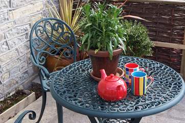 Enjoy coffee beneath the pergola.