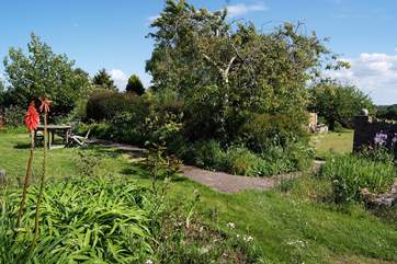 Guests are invited to find a peaceful spot in the Owners' gardens next to the cottage.