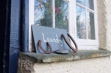 The laundry-room is across the courtyard from the cottage attached to the Owners' house.