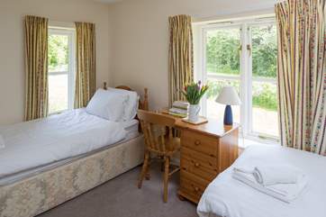 This is Waxcap, which has twin beds and an en suite shower-room and views to the front of the cottage.