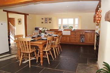 You come into this fantastic farmhouse kitchen with flagstone floor and a classic farmhouse table - the heart of the house.