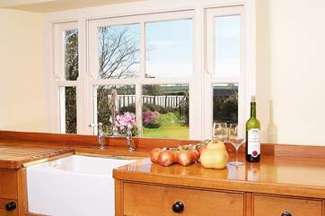 The kitchen looks out over the patio and garden.