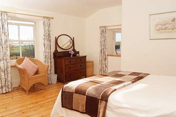 Bedroom 1 has wonderful views over the garden, the paddock and the whole valley beyond.