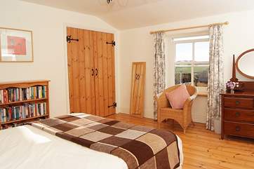 There are gorgeous wooden floors in this bedroom.