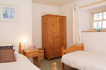 Bedroom 4 has twin beds and is great for adults and children alike. This bedroom has a view towards the church just behind the house.