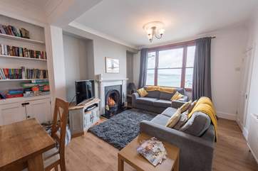 The comfortable sitting-area with a roaring wood-burner.