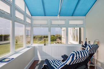 Take a pew in the conservatory and enjoy the view, whatever the weather.