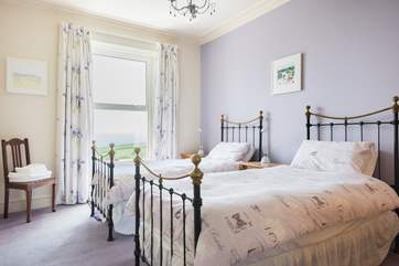The twin bedroom, Bedroom two, is spacious and has sea views.