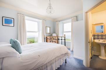 This double-aspect, Bedroom 3, has sea views from both windows and an en suite.