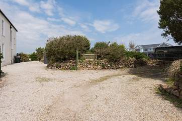 There is plenty of parking for multiple cars, to the right of the gravelled driveway (also shared access for Frog Rock Cottage)