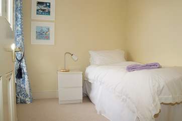 The pretty single bedroom is linked to the main bedroom with a door in between, and shares the shower-room.
