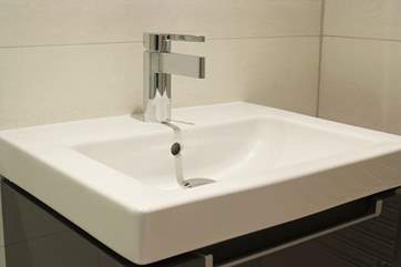 The en suite shower-room is equipped with wall hung wash-basin and WC courtesy of Villeroy and Boch.