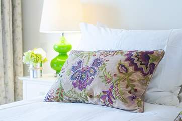 The purple and green theme continues in the bedroom.