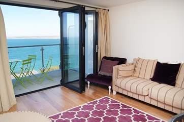 The living area looks out over the sea.