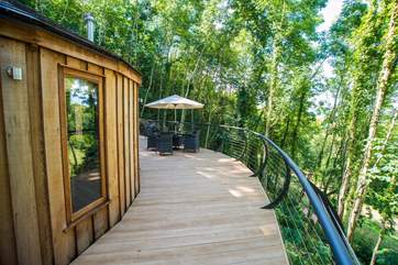 The huge deck sweeps round to the entrance.