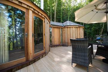 There are double doors from the living-area onto the deck as well as the large entrance door into the hallway.