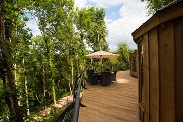 With its huge elevated deck jutting out into the woodland.