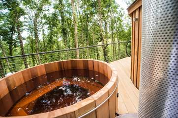 The cedar wood-fired hot tub - a must for the end of the day! The water takes a couple of hours to heat up initially.