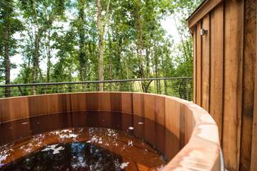 The cedar wood-fired hot tub on the deck.